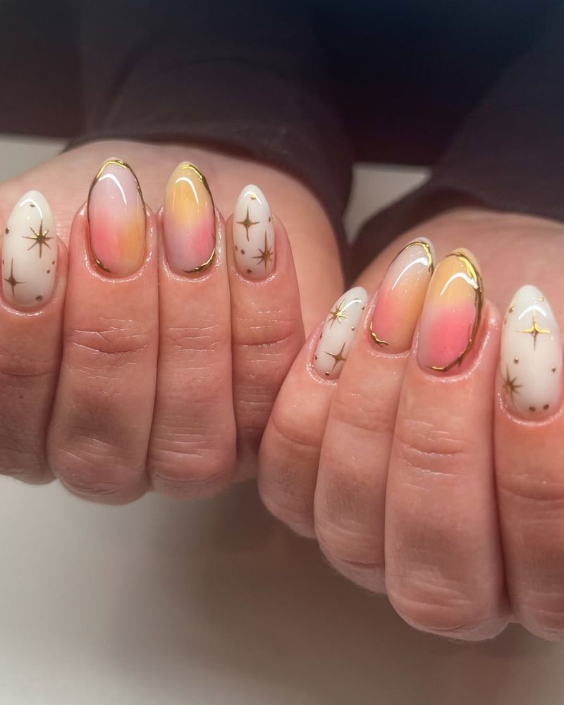 nail art céleste avec étoiles dorées