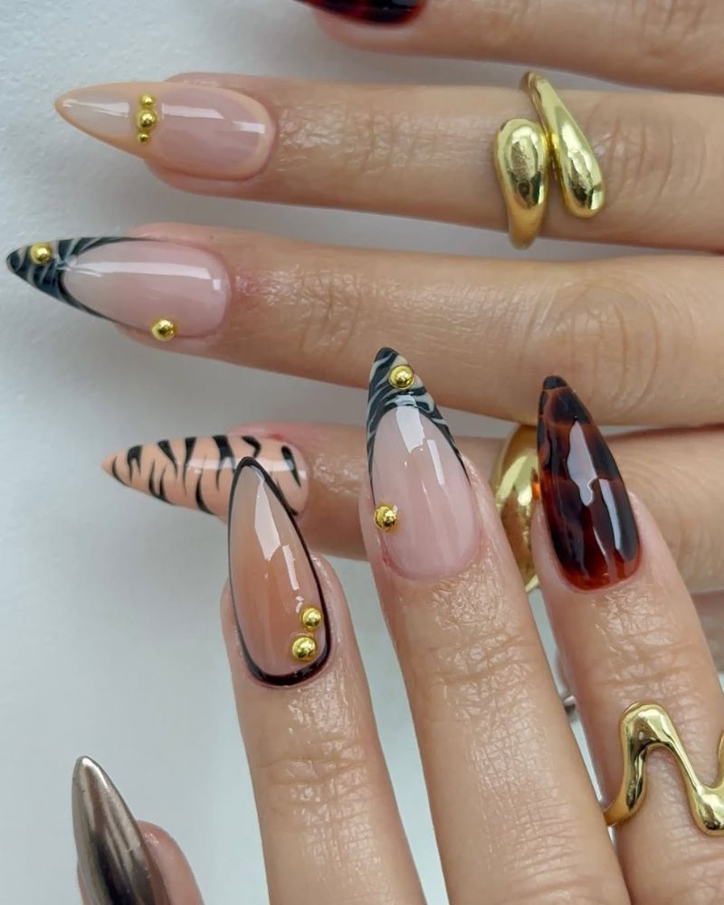 ongles d'automne avec nail art animaux sur pointes stilettos