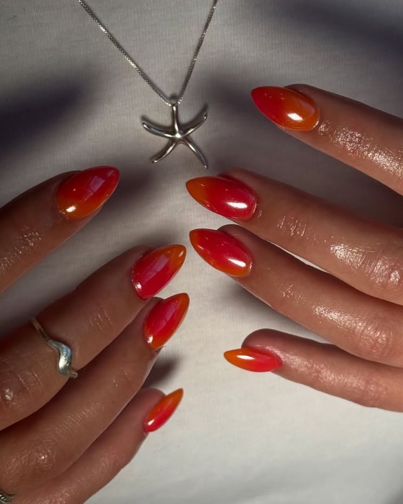 forme stiletto avec dégradé rose et orange façon coucher de soleil