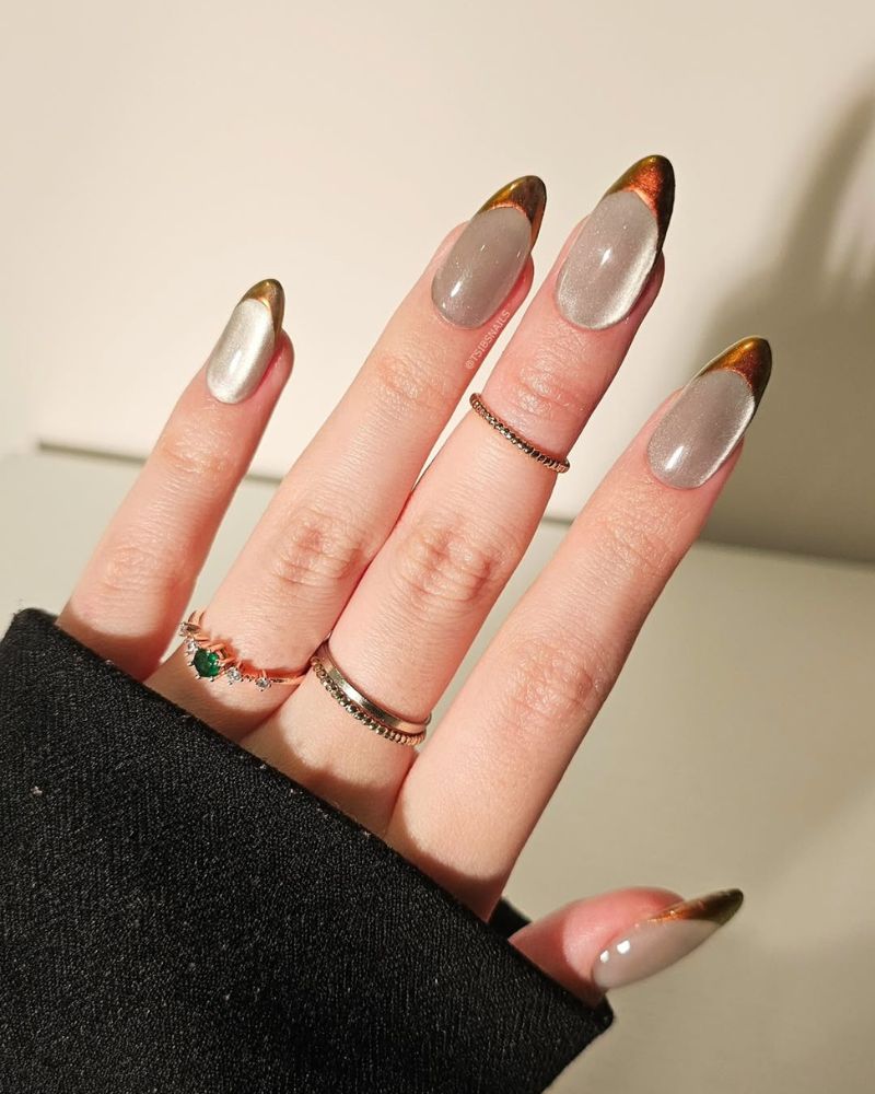 ongles crème cat eye avec pointes cuivre