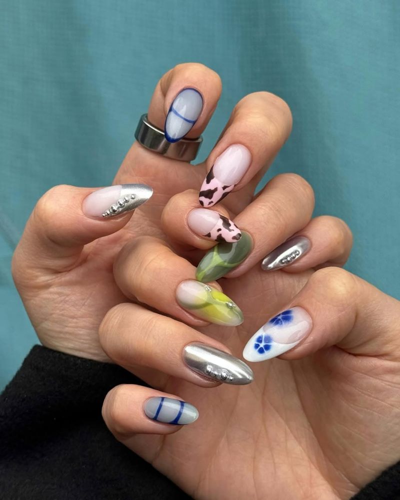 ongles blancs laiteux forme ronde chantilly avec nail art argent métallisé, vert et imprimé vache