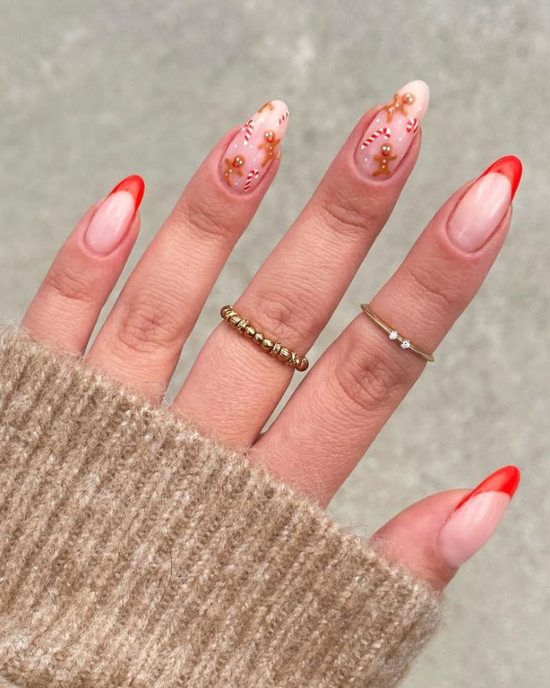 art d’ongle cane de bonbon et pain d’épices avec french tips rouges
