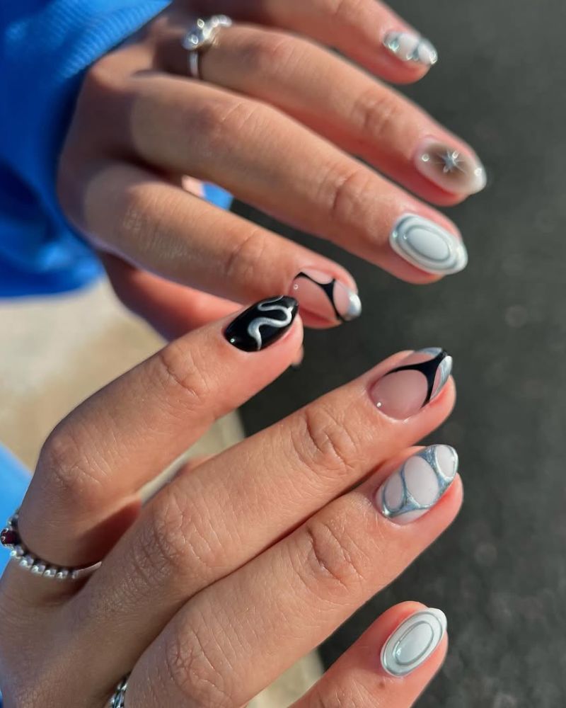 ongles blancs, noirs et argentés en manucure élégante