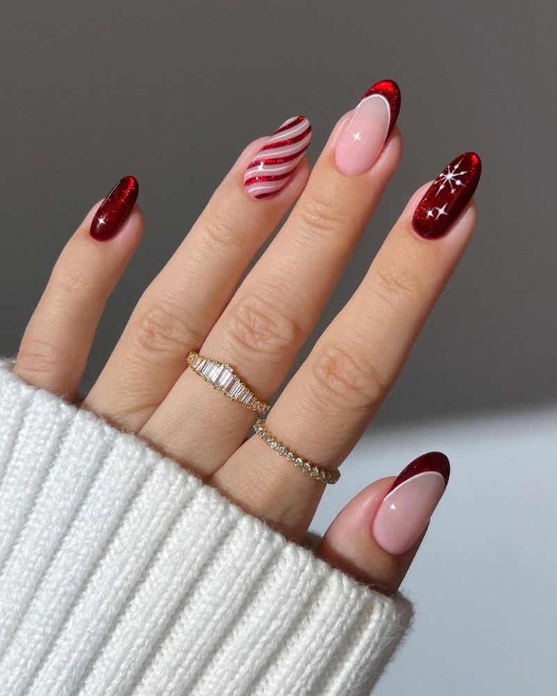 ongles oeil de chat rouges avec designs cane de bonbon