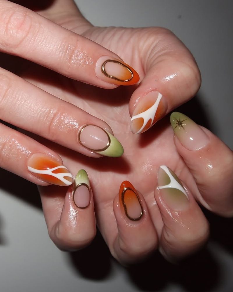 ongles verts et oranges avec nail art aura