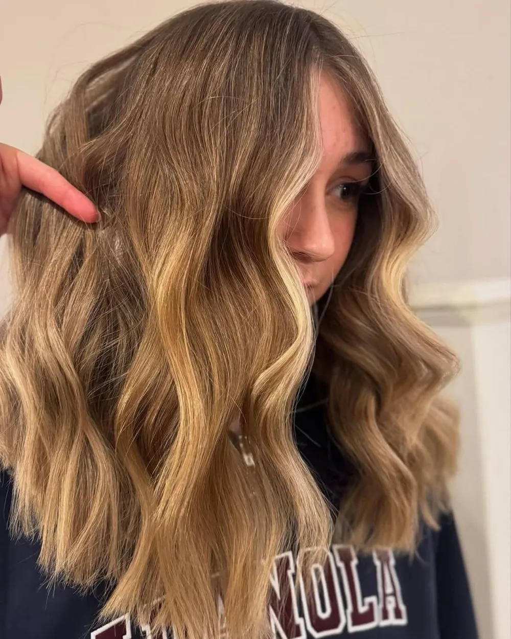 Balayage blond miel entre doré et caramel